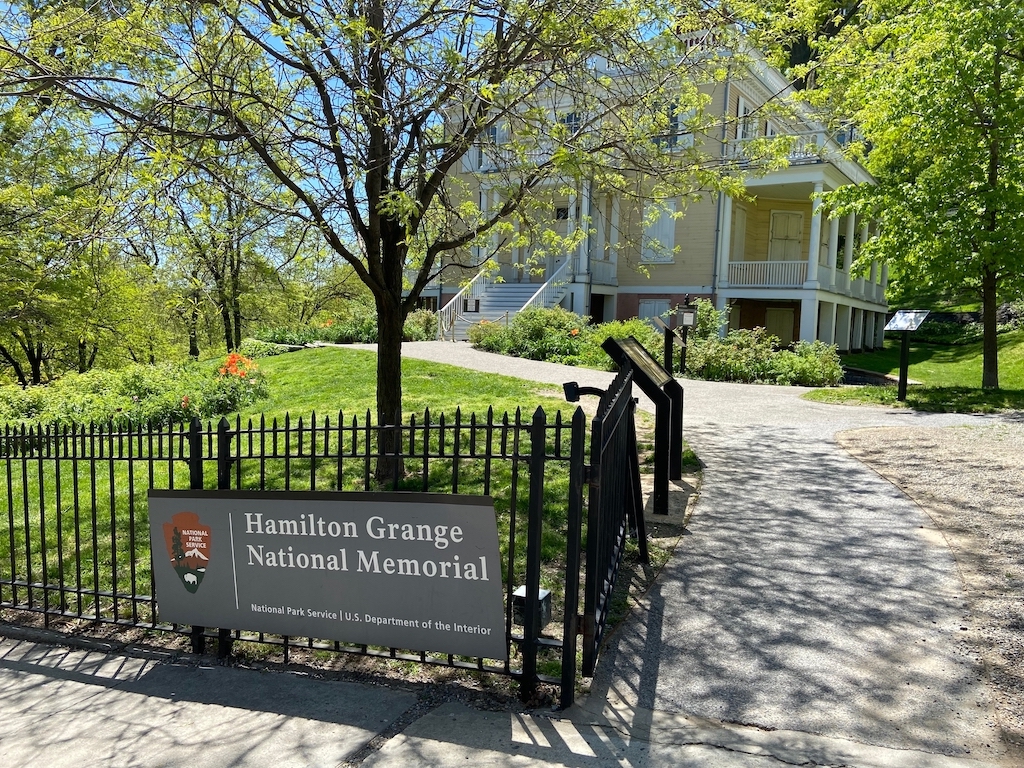 Hamilton Grange National Memorial in St. Nicholas Park with historic house, trees, and pathway in Hamilton Heights Harlem NYC