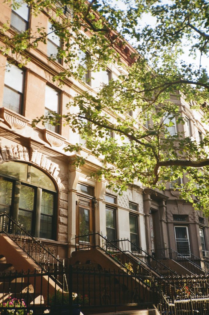 New York City brownstone representing homeownership, vacant property carrying costs, and long-term real estate ownership.