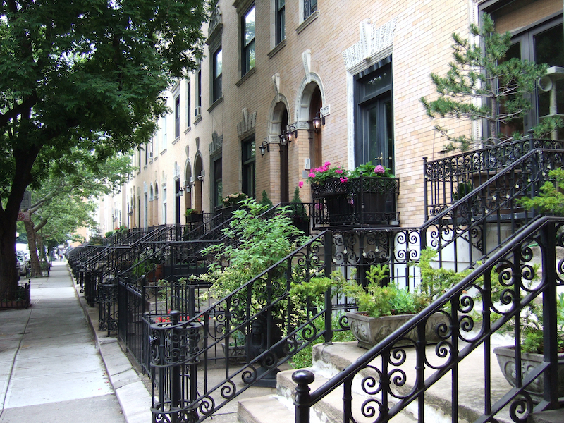 Historic row houses in a New York City landmark district illustrating the relationship between historic districts and property values.
